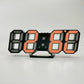 3D LED alarm clock with orange illuminated 3D digit display on black frame