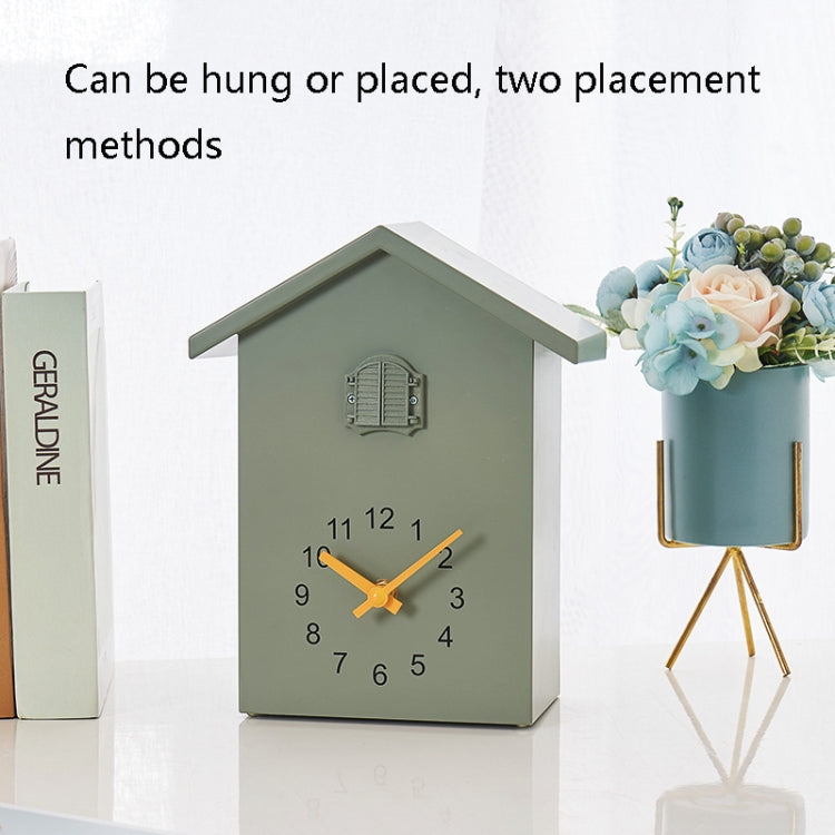 Green cuckoo wall clock designed for hanging or placing with pendulum weight