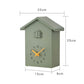 Cuckoo wall clock with green house body, gray roof, and orange clock hands