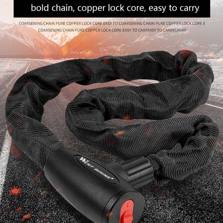 Black woven chain bicycle lock with black lock head lying on ground
