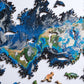 Wooden jigsaw puzzle with blue ocean pieces, green land, and animal cutout pieces