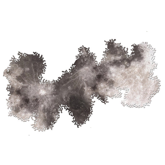 Wooden jigsaw puzzle pieces forming a dark gray galaxy-like shape