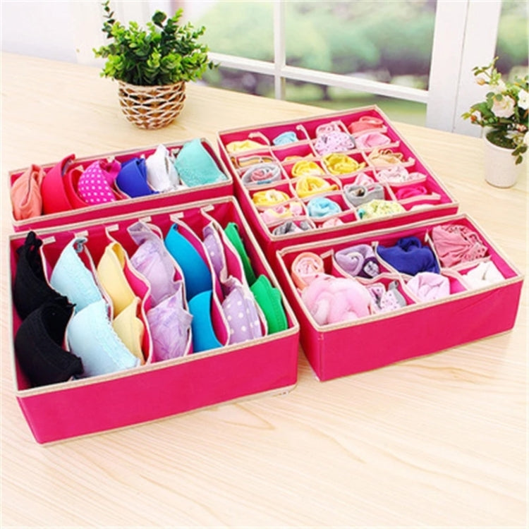 Pink drawer organizer boxes with grid dividers for underwear and socks, stacked on table