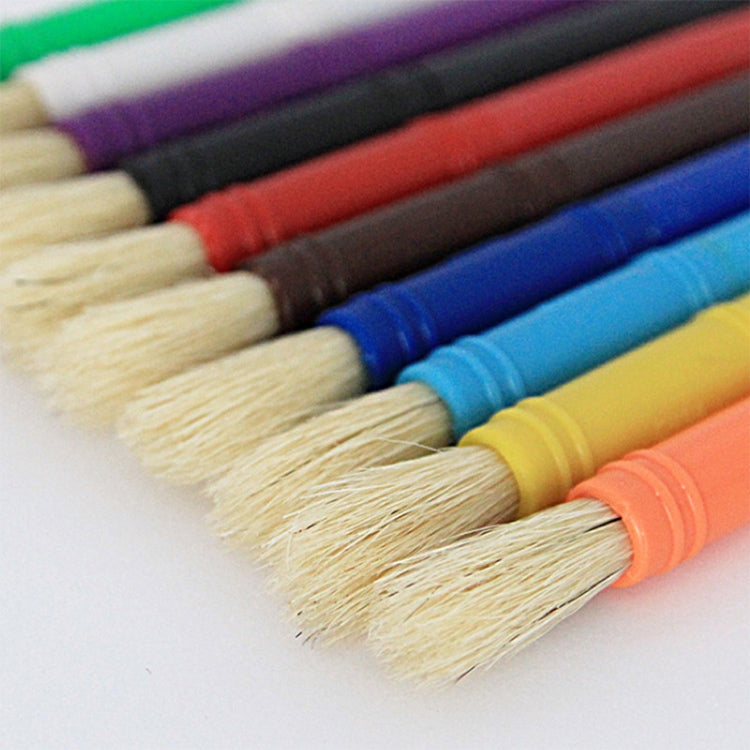 Close-up of pale bristle paint brushes with colorful plastic handles