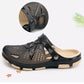 Black sandals with perforated upper and adjustable strap, beige tread sole