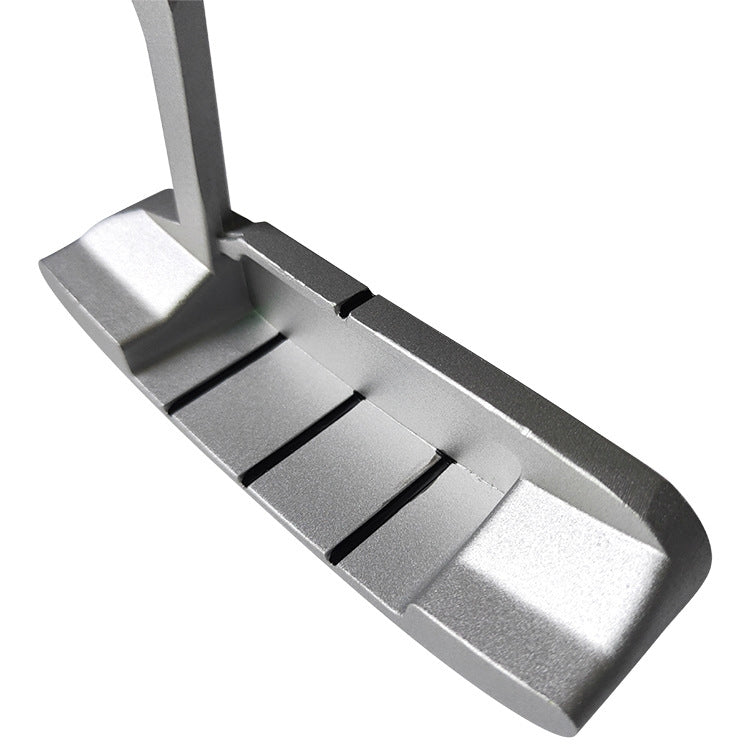 Children's golf putter head detail view showing central groove and ridged face