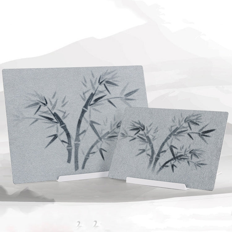 Two gray water writing boards with bamboo-style character practice marks