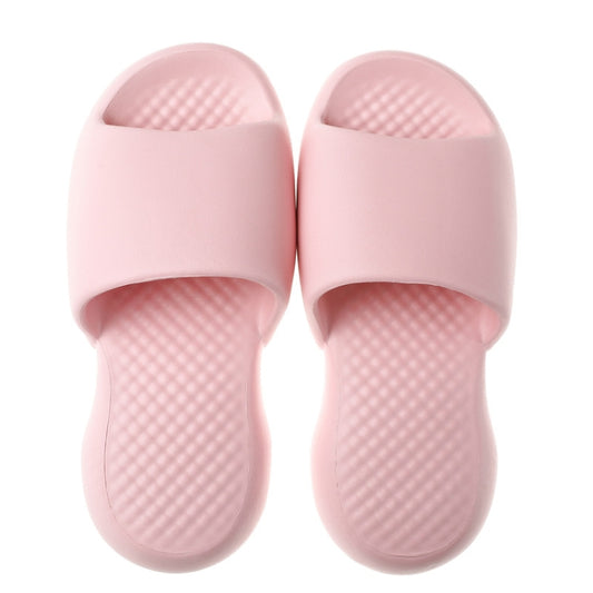 Pink open-toe slide slippers with thick cushioned plastic sole and textured footbed