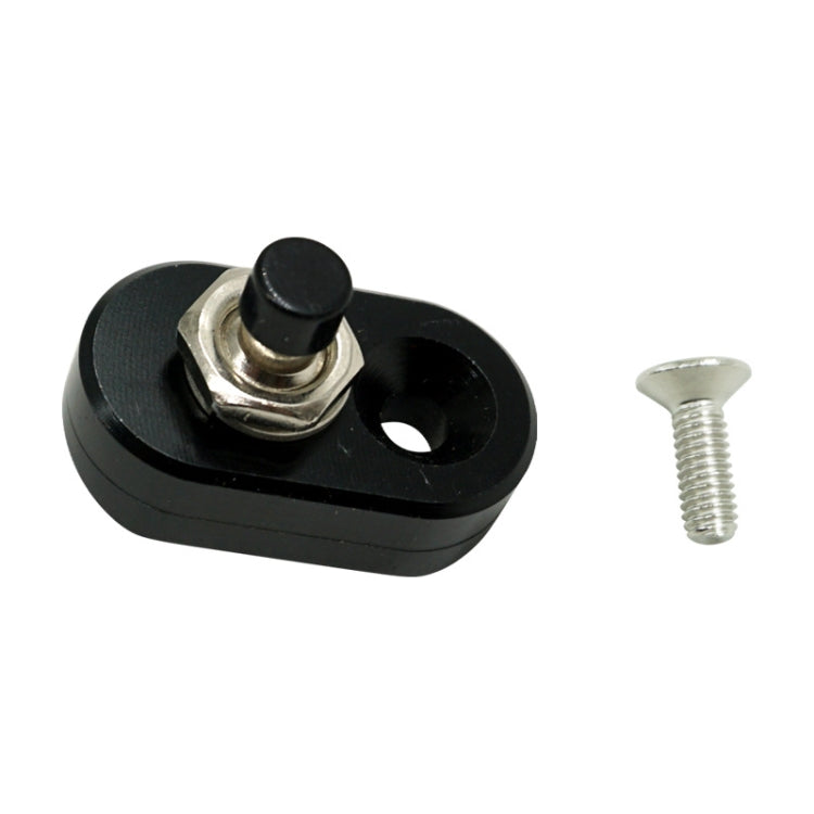 Black motorcycle handlebar switch base with round cap and mounting screw