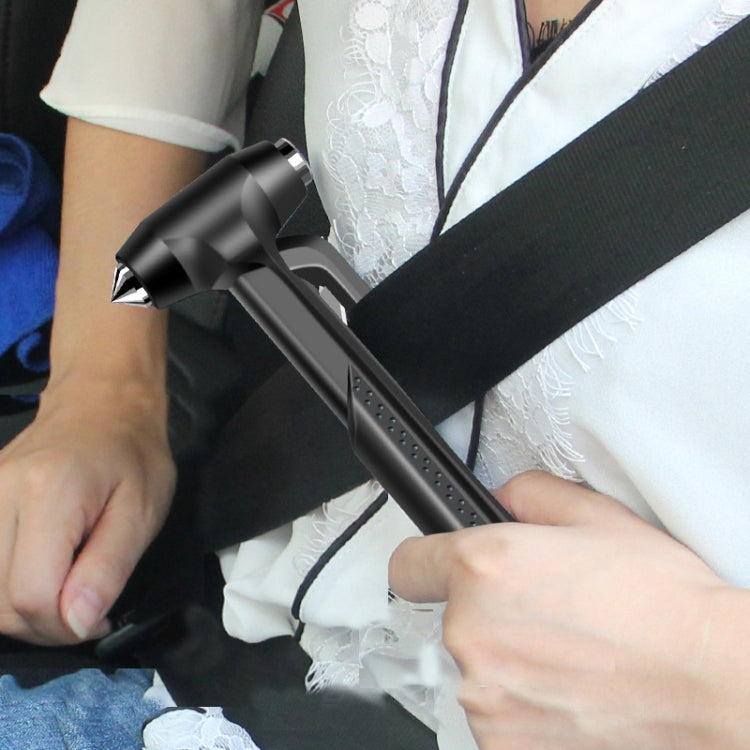 Car emergency window breaker hammer being held, black with pointed tip
