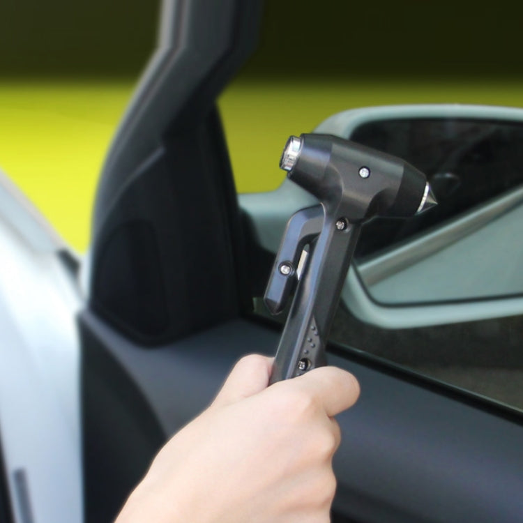 Car emergency window breaker hammer mounted near car window, black handle