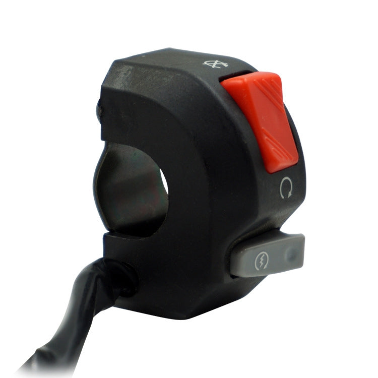Side view of black motorcycle switch with red rocker and gray accessory button