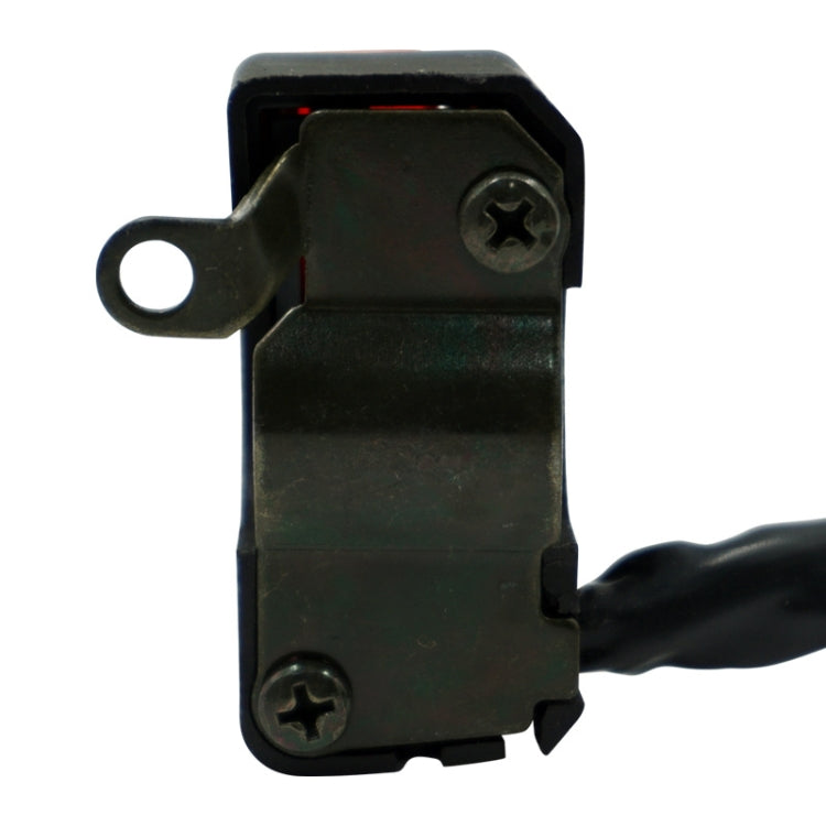 Rear view of black motorcycle switch with mounting eyelet and two screw holes