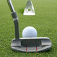 Golf putting practice trainer with ball ramp and two red alignment grooves, dark gray