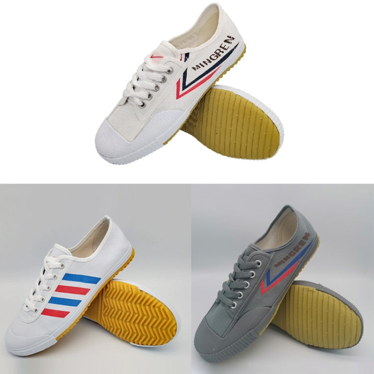 Set of track shoes: white pair with blue/red stripe and gray pair with blue/red stripe.