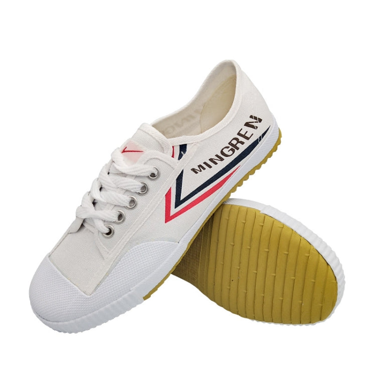 White canvas shoe with laced top, MINGREN side text, gum sole and red accents