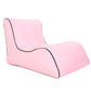 Single inflatable lounge sofa, pink with black piping and shaped backrest.