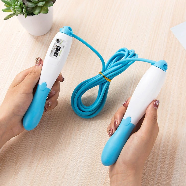 Blue PVC mechanical counting skipping rope held by hands with two foam handles and coiled rope
