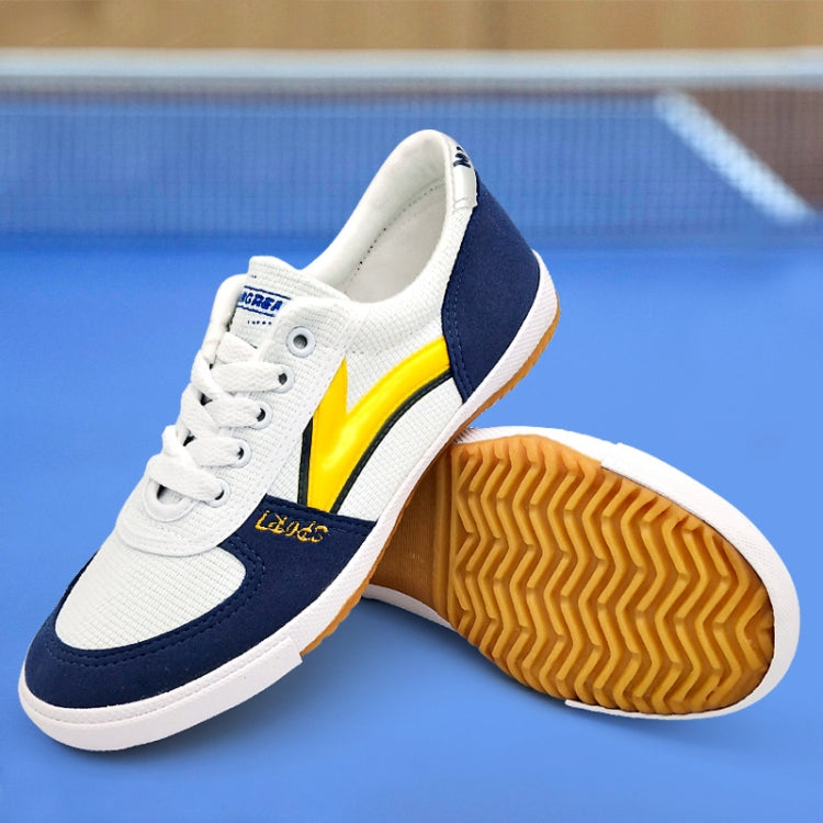Blue and white canvas sneakers with yellow side stripe and textured rubber outsole