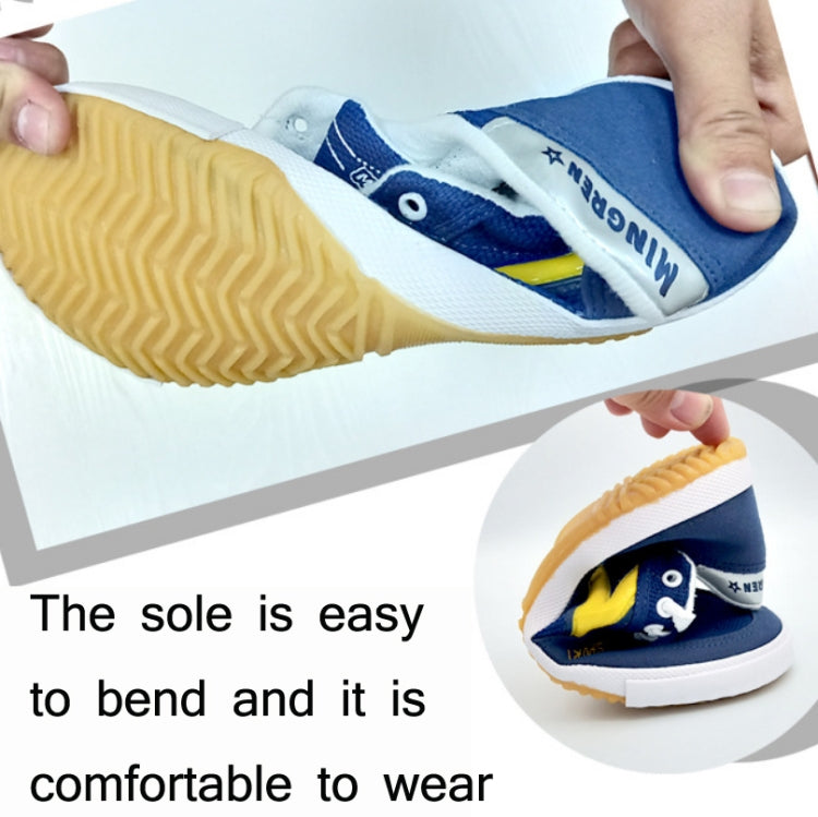 Canvas training sneaker being bent; blue upper with yellow detail and treaded outsole
