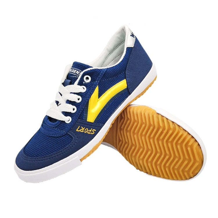 Blue canvas lace-up sneakers with yellow side stripe, white midsole, and treaded bottom