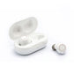 White wireless earbud hearing aids with open charging case and two earbuds
