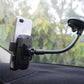 Car windshield automatic lock phone holder holding a phone on a suction mount