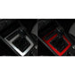 Red carbon-fiber trim sticker around manual shifter with two openings