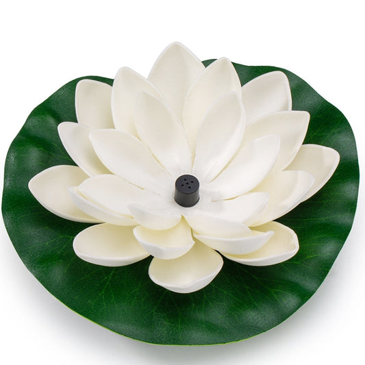 Lotus solar fountain centerpiece with white flower petals on green floating leaf