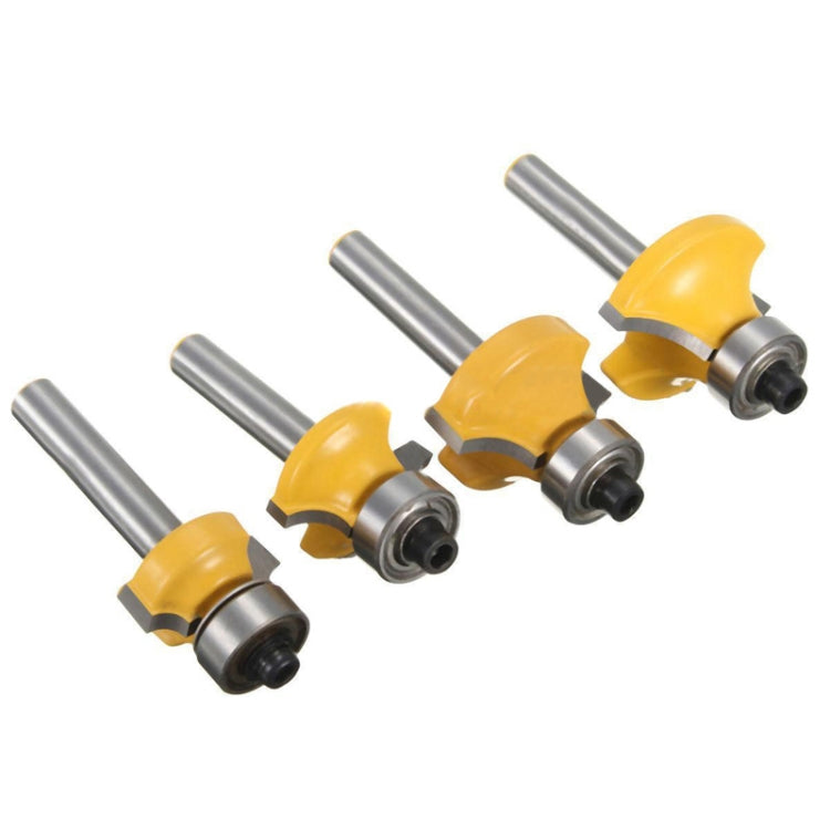 Four yellow router bits with metal shanks and 1/4 fittings, angled view