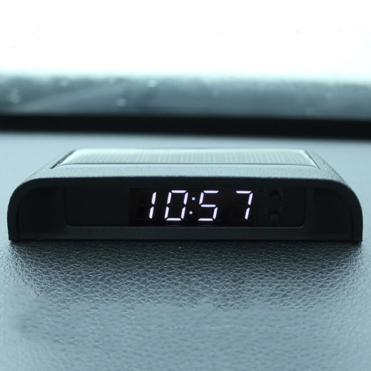 Car digital clock display on black housing, showing 18:57