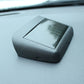 Car digital clock with solar panel on top, textured black housing