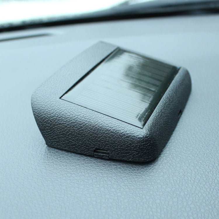Car digital clock with solar panel on top, textured black housing