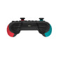 Wireless game controller top view with red and teal grip accents and shoulder buttons