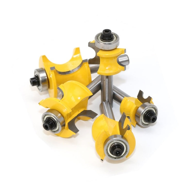 Mixed angle view of five yellow semicircular router cutter bits with metal shanks