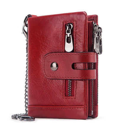 Red tri-fold leather wallet with chain strap, front belt tab, and zipper pocket