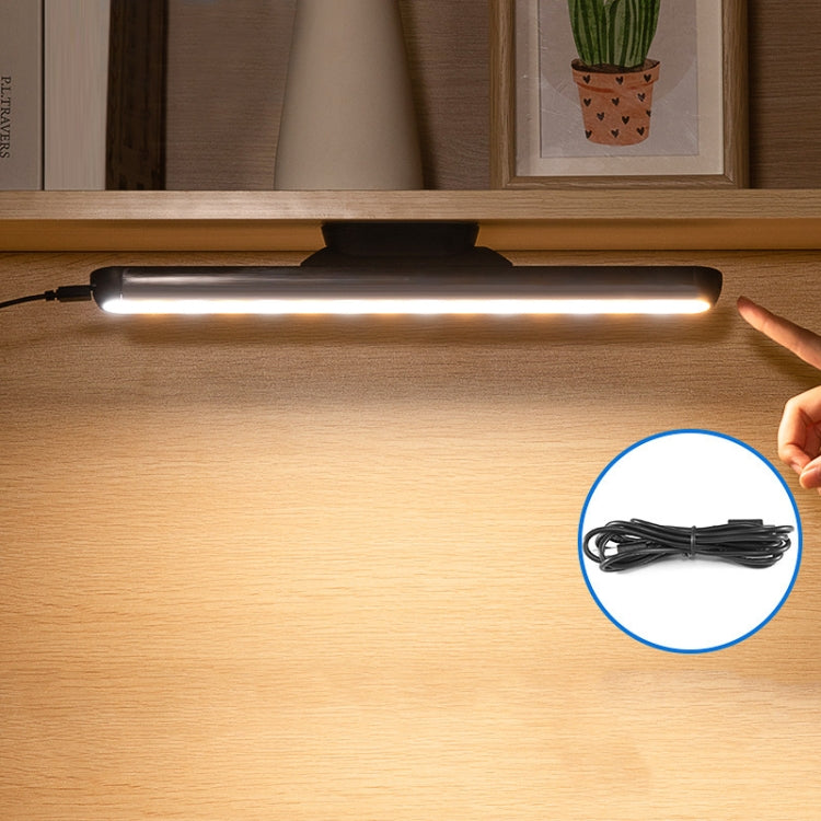 Black LED desk lamp bar with warm white glow and slim base for reading