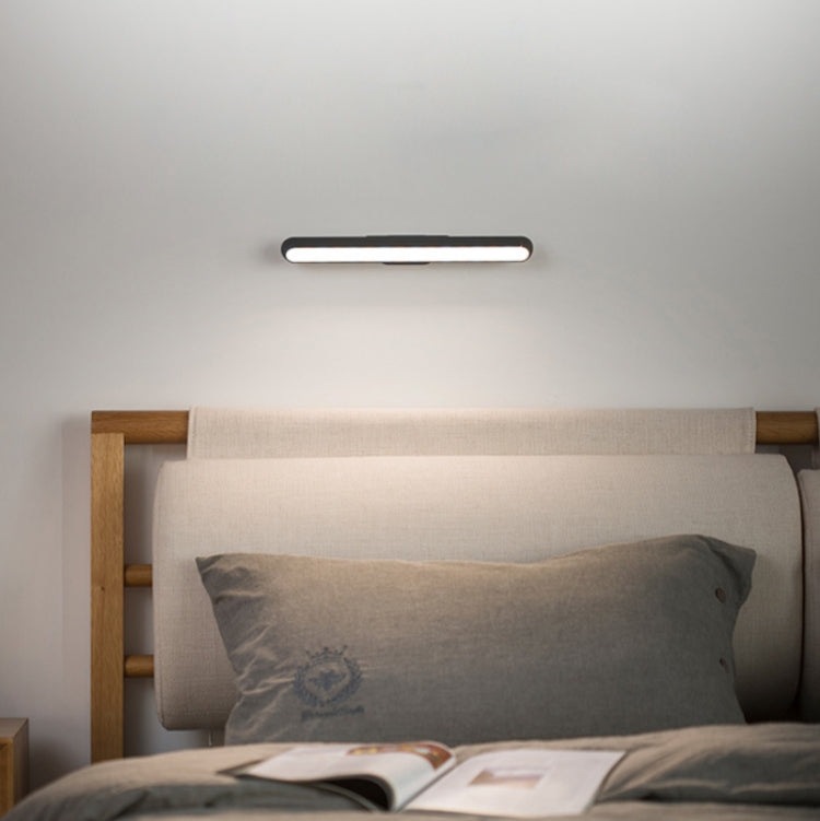 Glowing LED light bar mounted above bed for soft, eye-friendly lighting