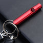 Red metal whistle keychain with keyring and end cap detail