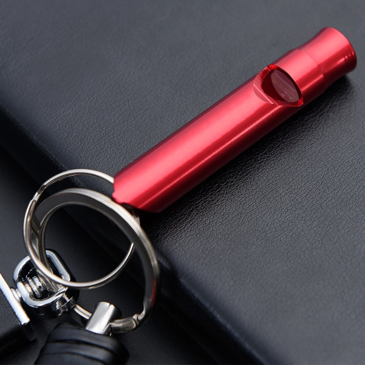 Red metal whistle keychain with keyring and end cap detail