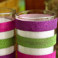 Glitter tape stripes on glass jars: pink, white, green metallic rolls