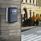 Wall-mounted password key box on a wall, dark gray with lock cover