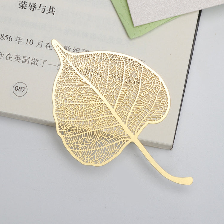 Metal hollow bookmark shaped like a gold leaf with cutout vein pattern