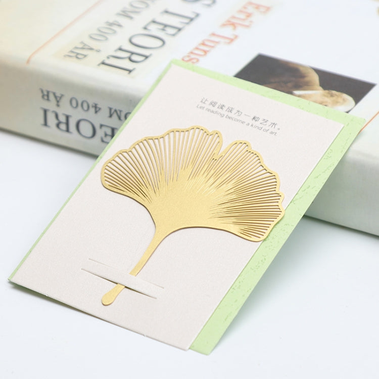 Metal hollow bookmark shaped like a gold ginkgo leaf
