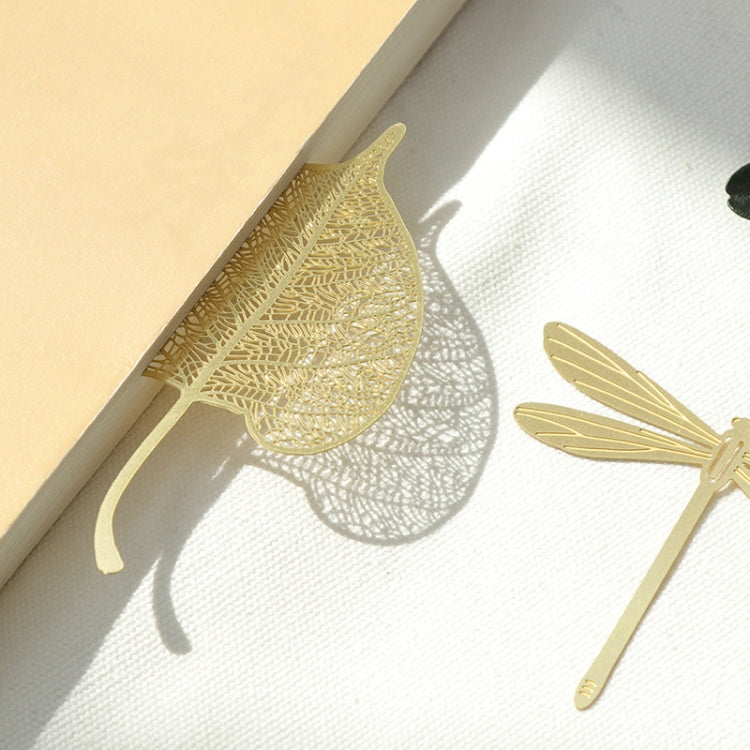 Metal hollow bookmark in gold leaf shape with openwork cutout pattern