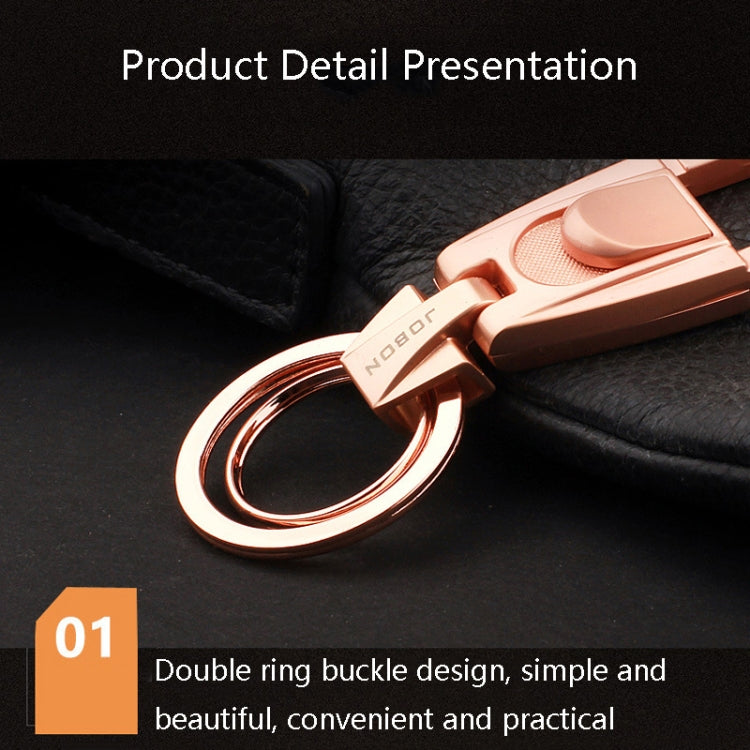 Rose-gold tone keychain pendant with double-ring buckle and textured surface detail