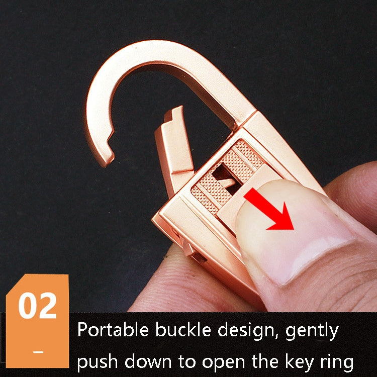 Close-up of rose-gold keychain buckle latch on a double-ring car keychain
