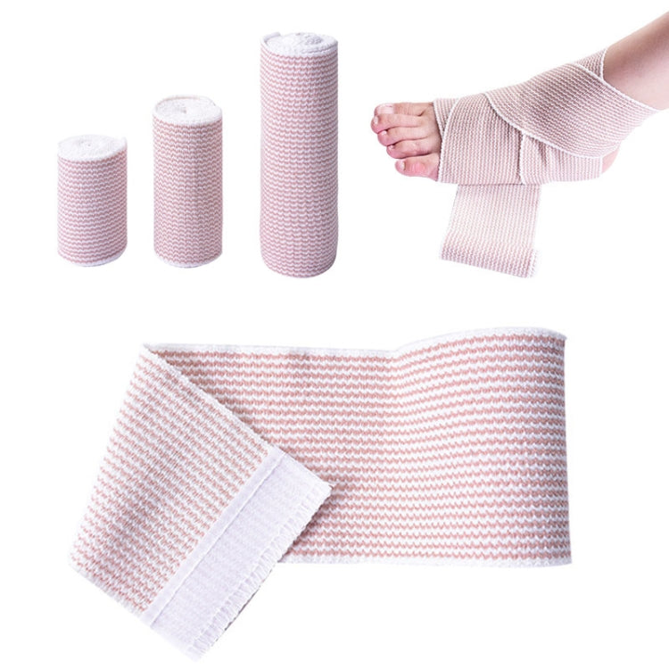 Pink-and-white elastic compression bandage strips, self-adhesive end tab, with rolls