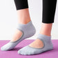 Backless non-slip yoga socks in light gray with open back and grip sole