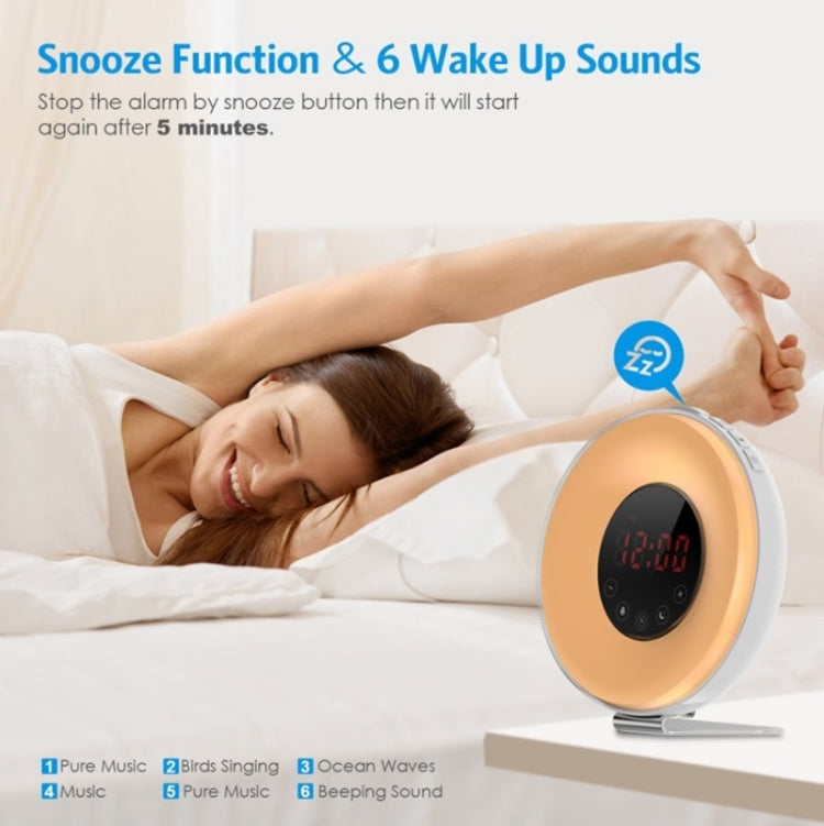 Sleep light alarm clock with gold globe, orange digital time, snooze icon near controls